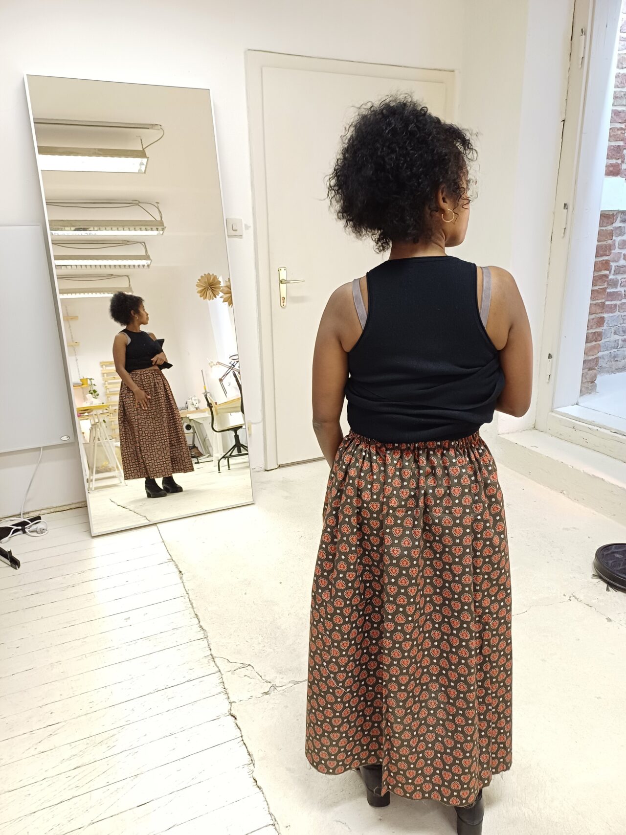 Sewing beginner in self-sewn skirt