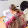 Participant of beginner sewing workshop at the sewing machine